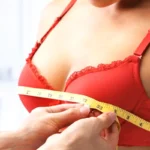 girl measuring boob